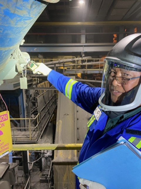 An HSE professional in full PPE conducting a site inspection
